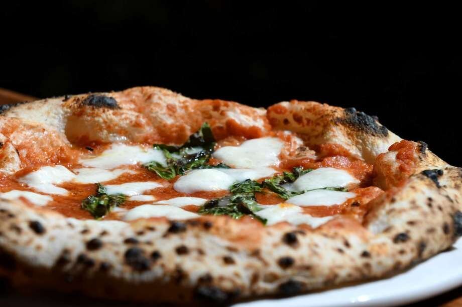 The cornerstone of Neapolitan pizza: San Marzano tomatoes, Caputo flour, and wood-fired mastery.