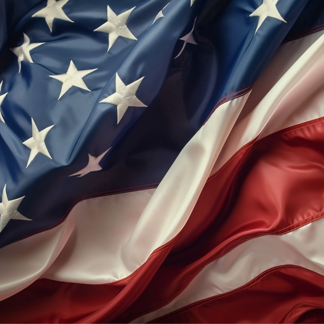 American flag flying over Plymouth — honoring service and community dedication in 2025.